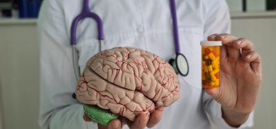 Doctor holds psycho neurological pills for brain in hands