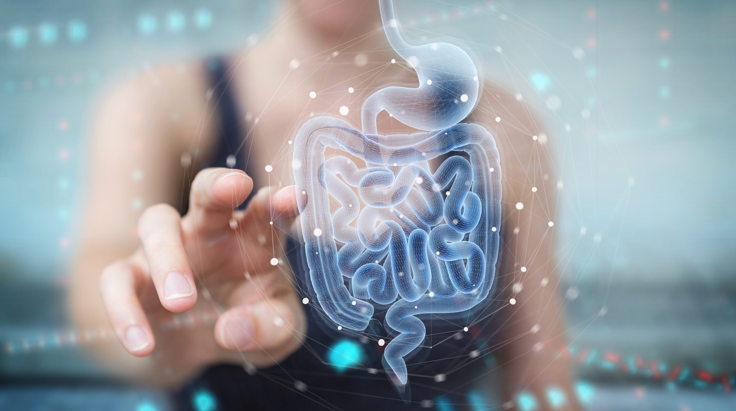 Woman on blurred background using digital x-ray of human intestine holographic scan projection 3D rendering