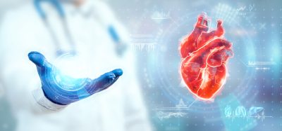 The doctor looks at the Heart hologram, checks the test result on the virtual interface, and analyzes the data. Heart disease, myocardial infarction, innovative technologies, medicine of the future